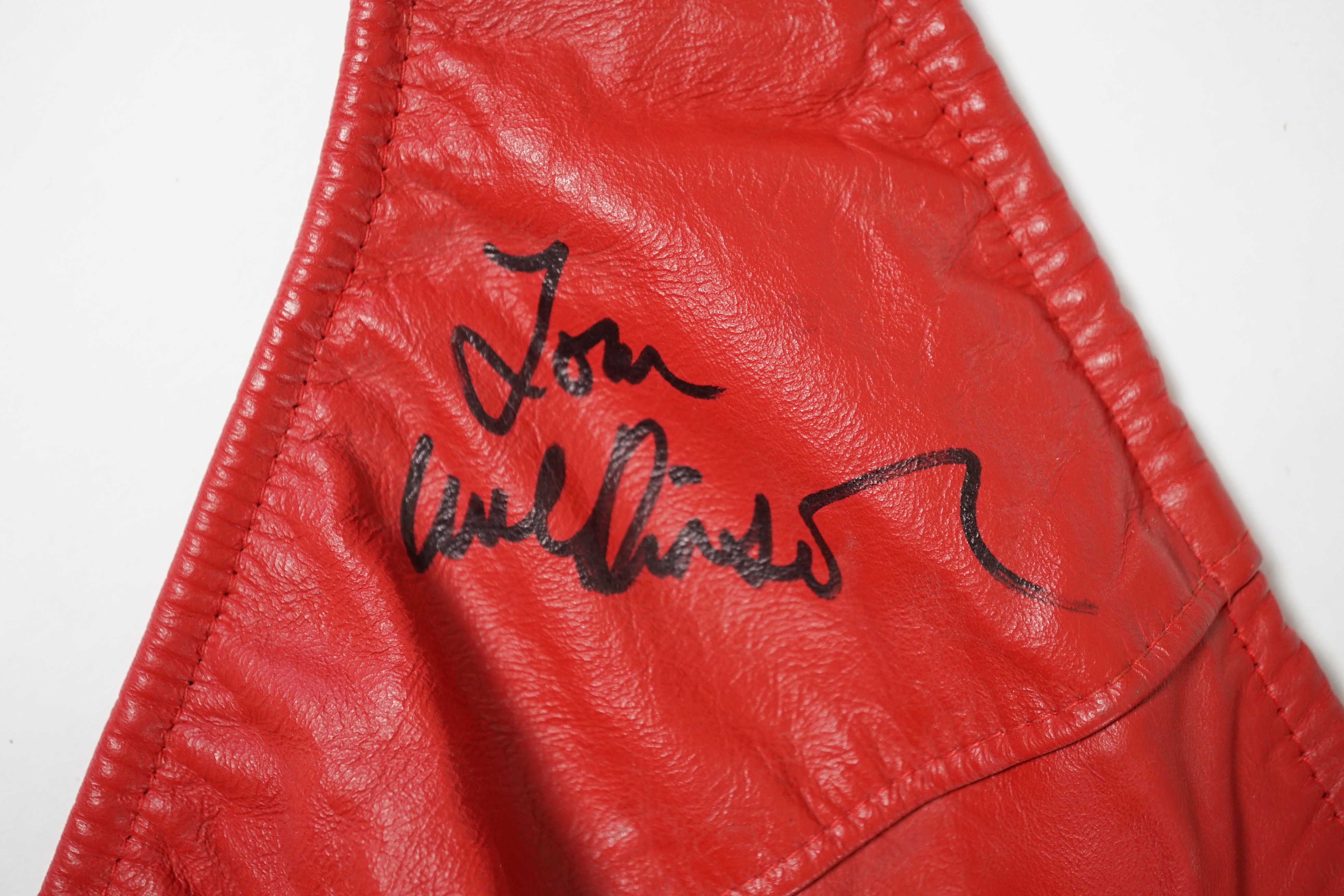 A red leather thong, as worn by Tom Wilkinson in the film The Full Monty and signed by him, together with a signed note confirming authenticity.